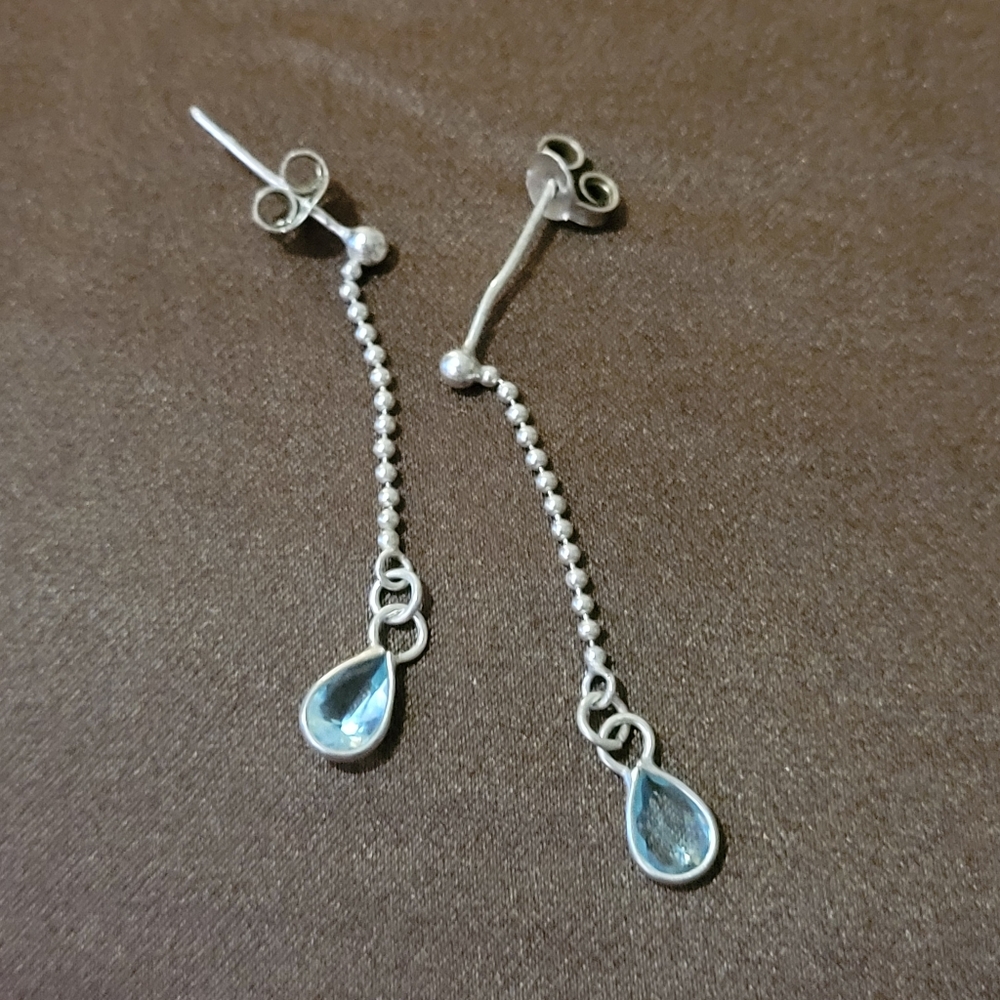 Sterling silver earrings with light blue stone
